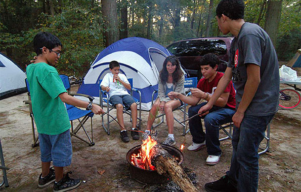 Primitive tent campsite in wooded setting at Adventure Bound Four Winds