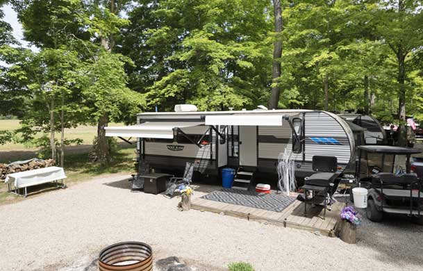 Tent campsite surrounded by trees at Green Valley