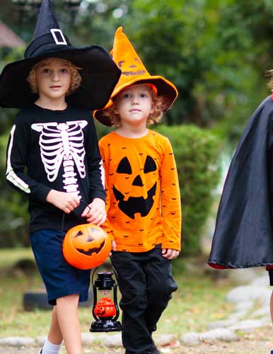 Cute girl sitting at a campsite, holding a pumkin